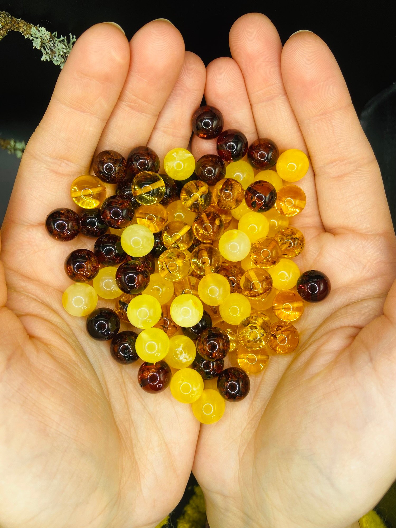 Baltic Amber beads in woman’s hands