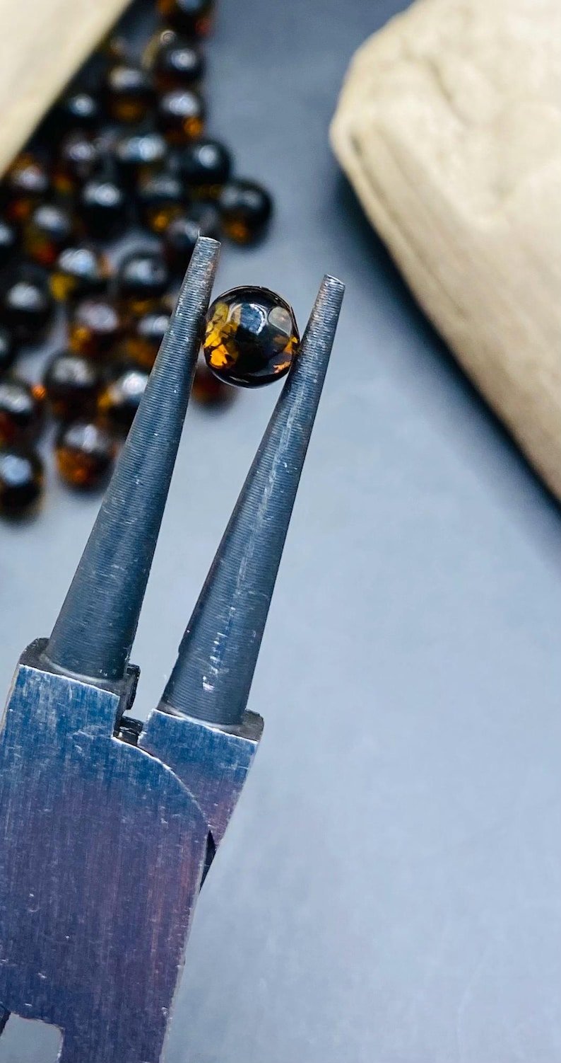 56548094-r-il-18ac31-7173896268-il_794xN.7173896268_1hn6 6mm Daudzšķautņainas krāsu mainošās Dzintara pērlītes