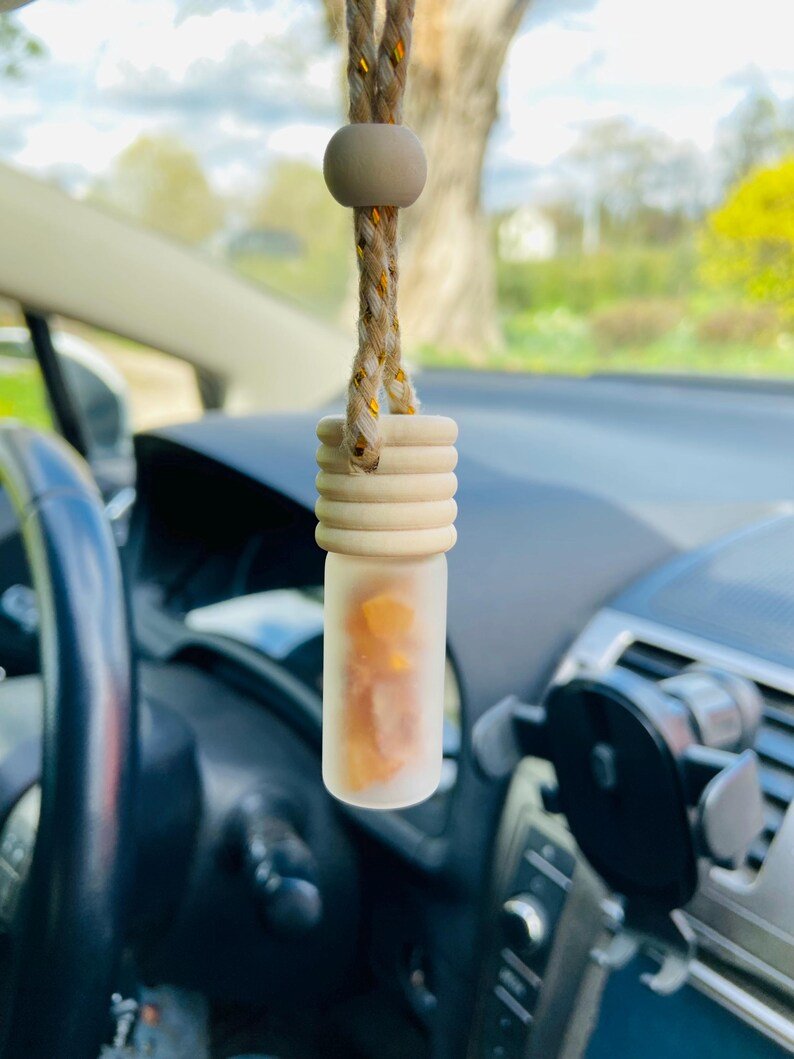 56548094-r-il-c1593d-6833175566-il_794xN.6833175566_h038 Auto gaisa atsvaidzinātājs ar dzintara gabaliņiem