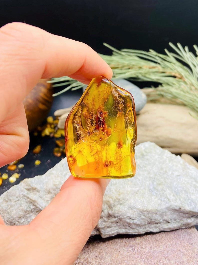 56548094-r-il-ef6304-7218813550-il_794xN.7218813550_sfzo Pulēti stikla tipa Dzintara akmeņi, katrs 7 grami smags