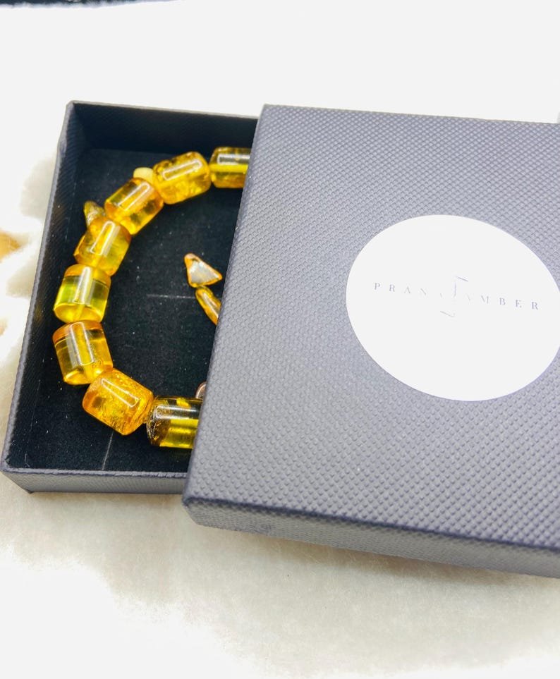 56548094-r-il-0f1604-7330472752-il_794xN.7330472752_bywv Caurspīdīga citrona krāsas ekskluzīva Dzintara aproce