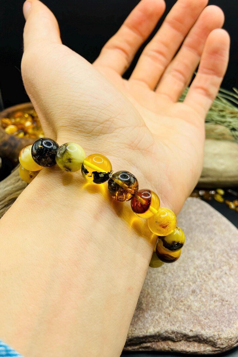 56548094-r-il-1629e2-7271518350-il_794xN.7271518350_orja 11mm Daudzkrāsainu Dzintara pērlīšu aproce