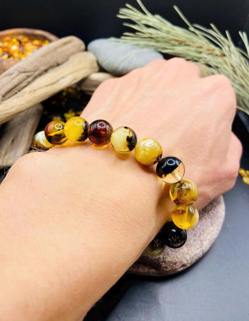 56548094-r-il-3b56cd-7319459679-il_794xN.7319459679_pck7 11mm Daudzkrāsainu Dzintara pērlīšu aproce