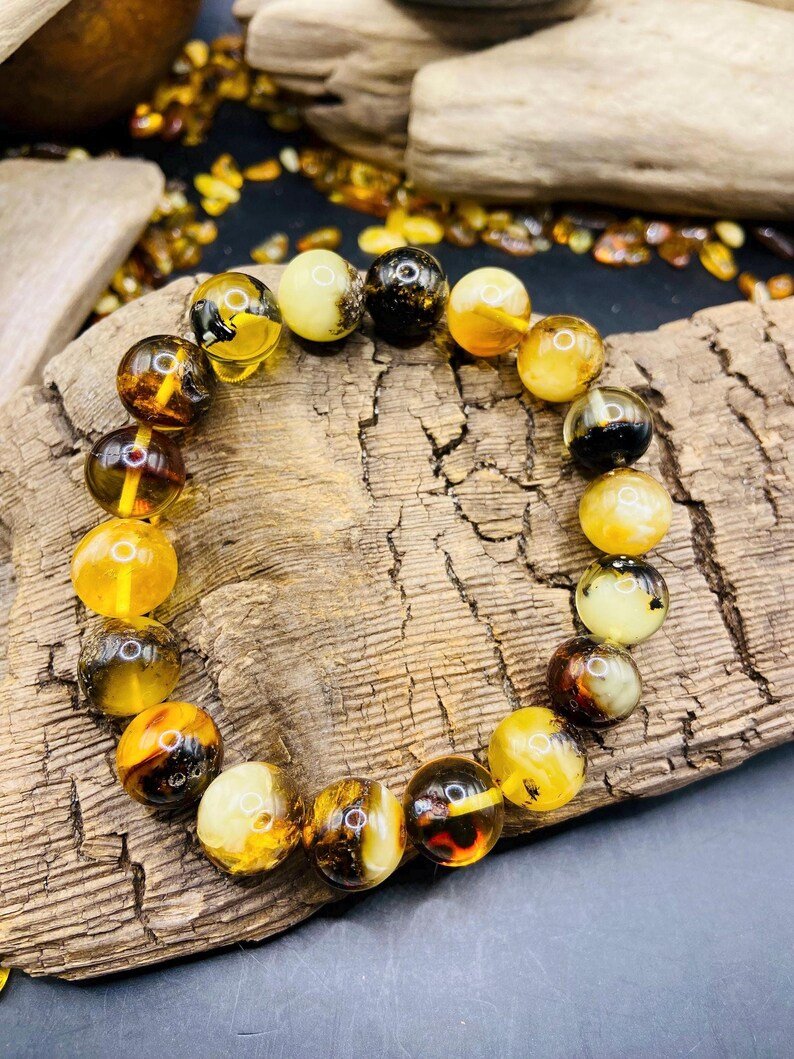 56548094-r-il-542f0d-7271516168-il_794xN.7271516168_scrs 11mm Daudzkrāsainu Dzintara pērlīšu aproce