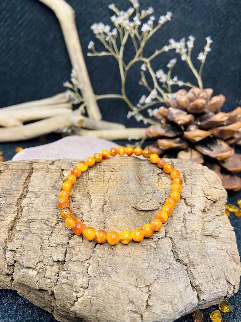 56548094-r-il-6aff55-6836956855-il_794xN.6836956855_efq0 Ugunīgā Baltijas Dzintara apaļo pērlīšu aproce