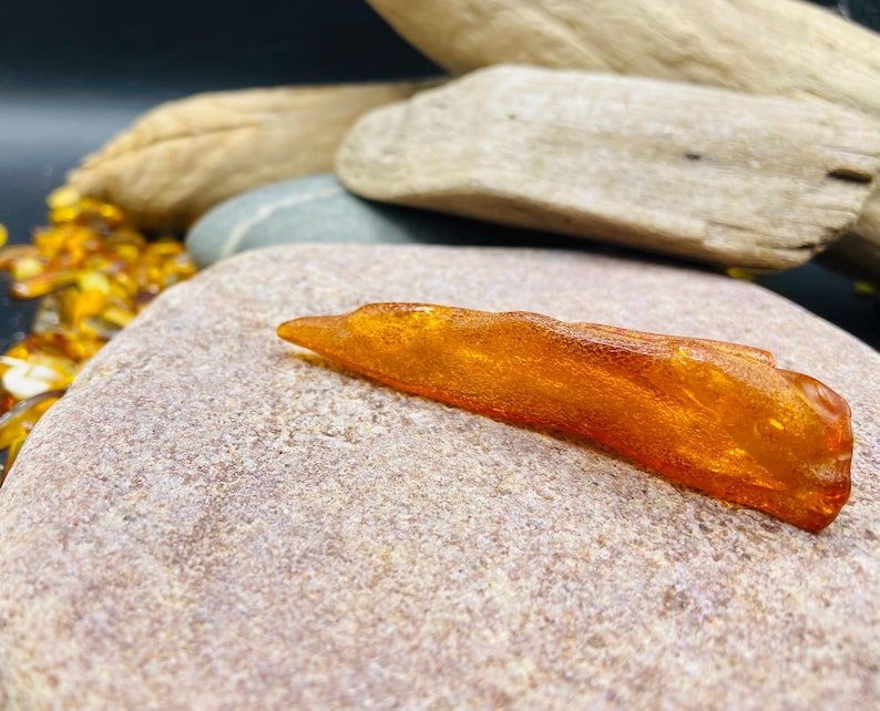 56548094-r-il-7e78a5-7344274818-il_794xN.7344274818_8r66 Garš Dzintara gabaliņš spilgtā konjaka krāsā