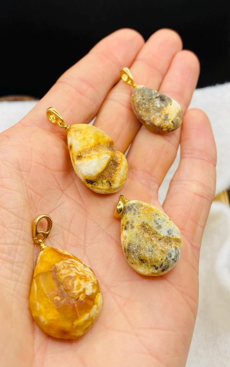 Premium klases neapstrādāti gaišās krāsas Dzintara kuloni