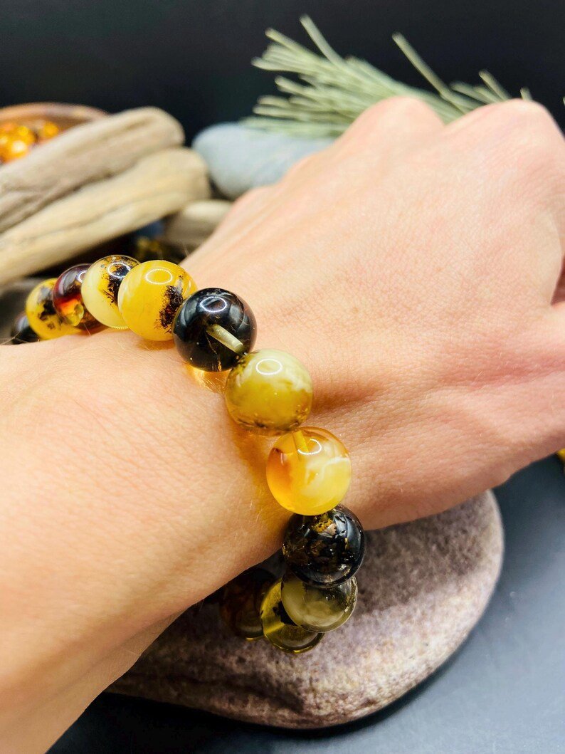 56548094-r-il-b12a96-7271521098-il_794xN.7271521098_dlyr 11mm Daudzkrāsainu Dzintara pērlīšu aproce