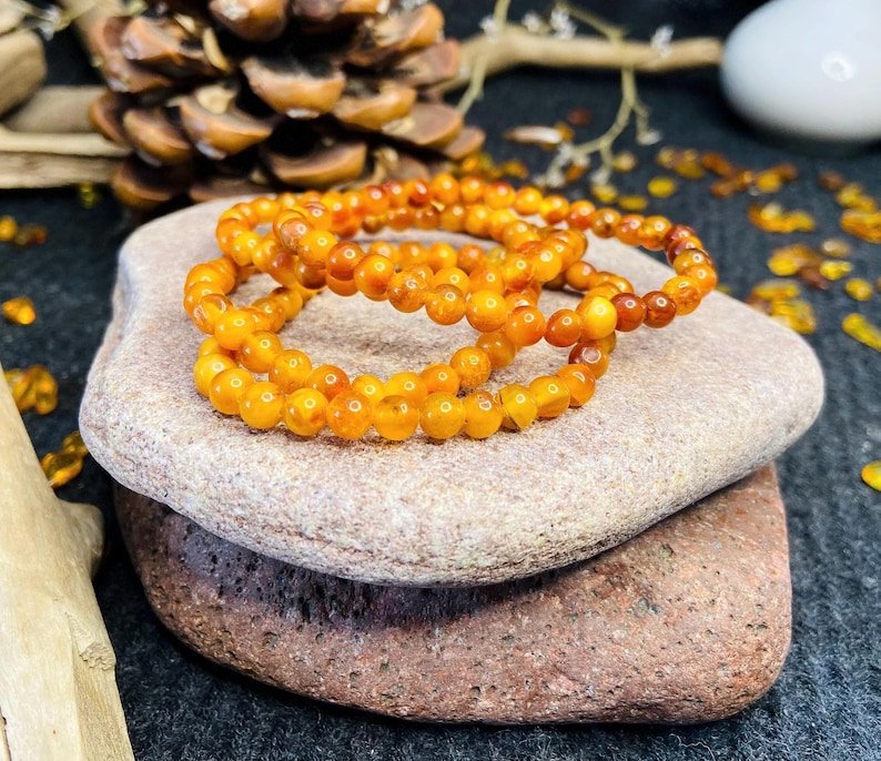 56548094-r-il-b20170-6836959167-il_794xN.6836959167_iamb Ugunīgā Baltijas Dzintara apaļo pērlīšu aproce