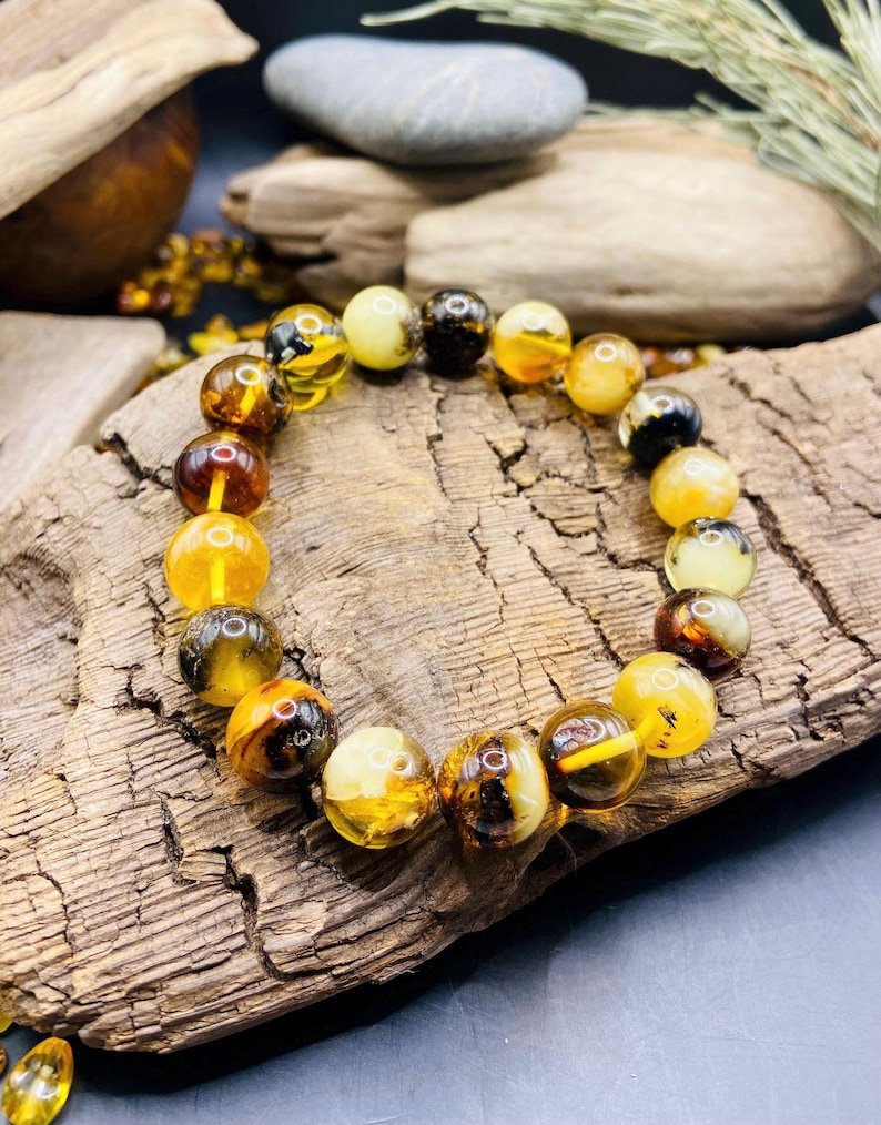 56548094-r-il-c3ef07-7271515446-il_794xN.7271515446_6vez 11mm Daudzkrāsainu Dzintara pērlīšu aproce