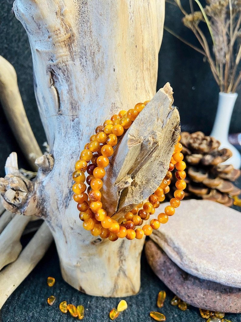 56548094-r-il-ea264c-6836960101-il_794xN.6836960101_nkby Ugunīgā Baltijas Dzintara apaļo pērlīšu aproce