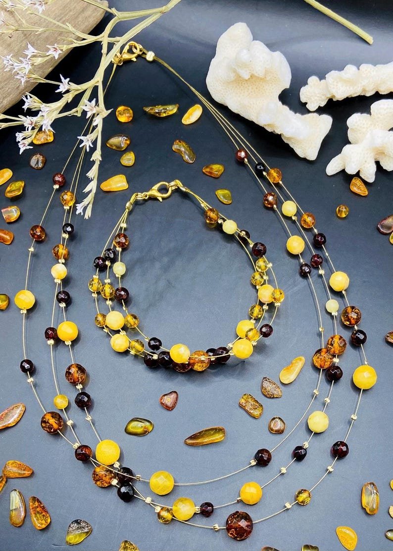 56548094-r-il-fd297a-6817266429-il_794xN.6817266429_2303 Baltijas Dzintara trīs stiepļu aproces un kaklarotas komplekts