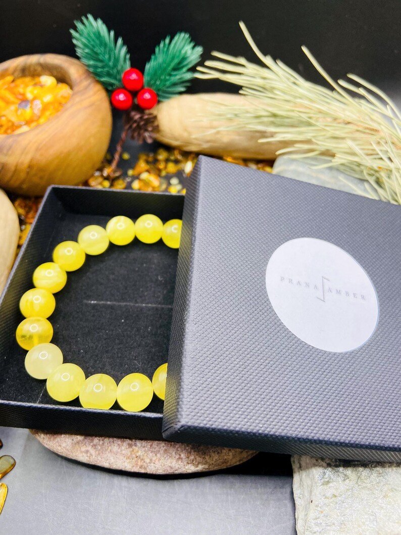 Premium klases 11mm apaļu pērlīšu Dzintara piena krāsas aporoce