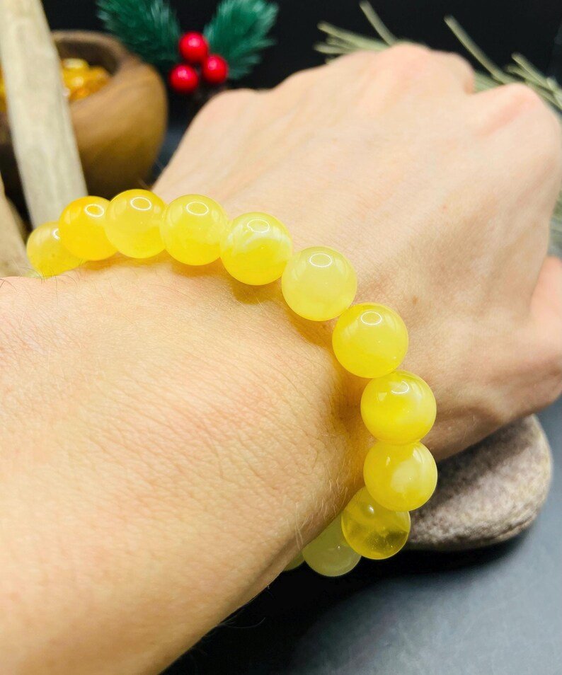 Premium klases 11mm apaļu pērlīšu Dzintara piena krāsas aporoce