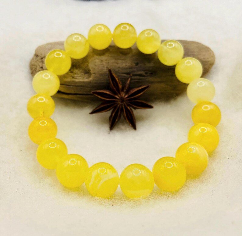 Premium klases 11mm apaļu pērlīšu Dzintara piena krāsas aporoce