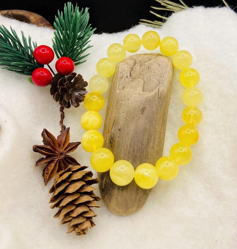 Premium klases 11mm apaļu pērlīšu Dzintara piena krāsas aporoce