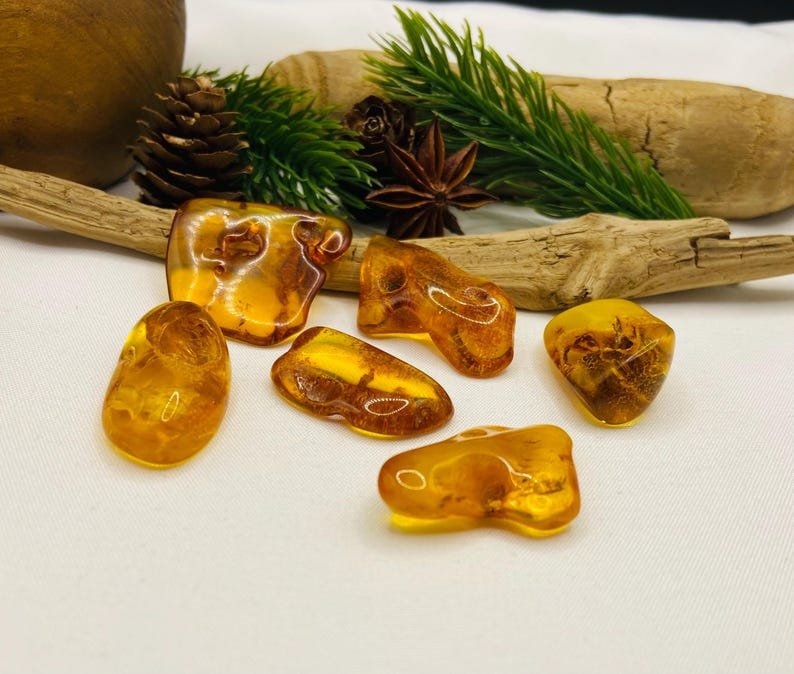 Autentiski Dzintara Odina akmeņi ar dabiskiem caurumiem