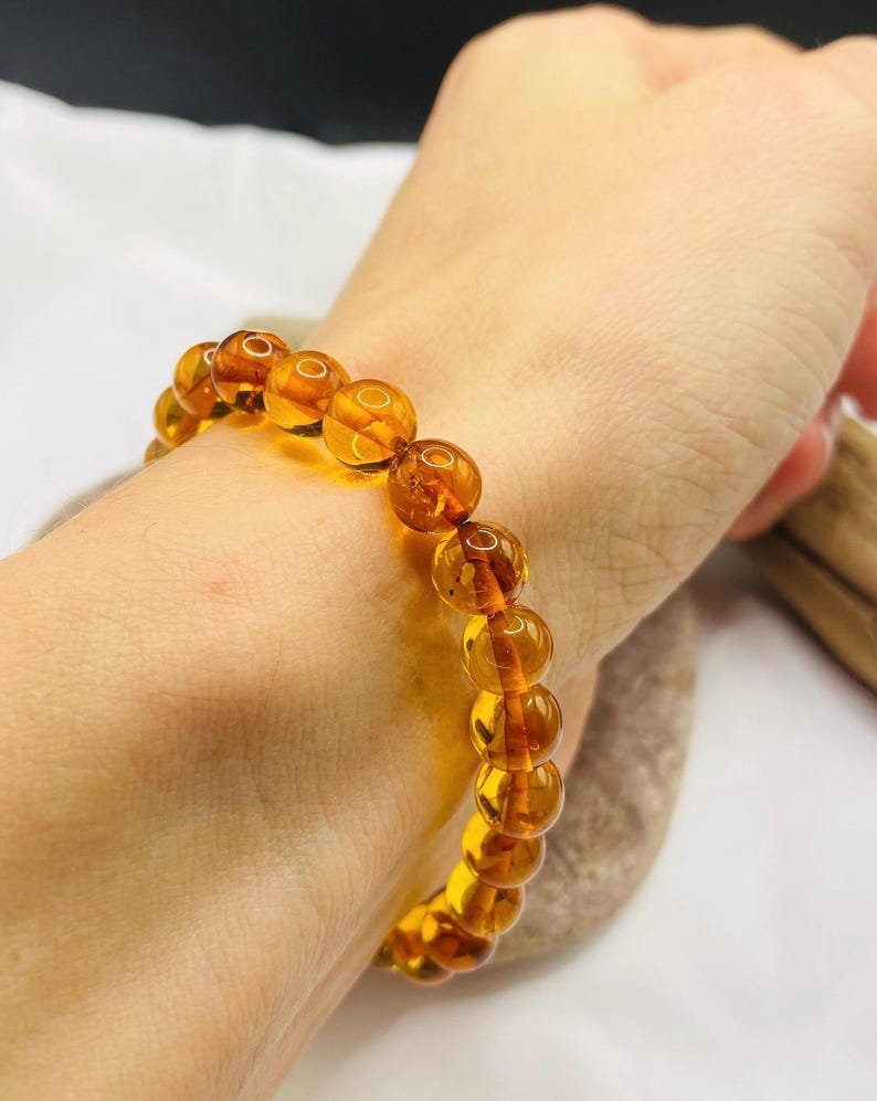 56548094-r-il-a2ee85-7498238885-il_794xN.7498238885_66y8 Eleganta konjaka krāsas aproce ar 8mm apaļām pērlītēm